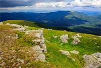 white sharp stones on the hillside in hight mountains